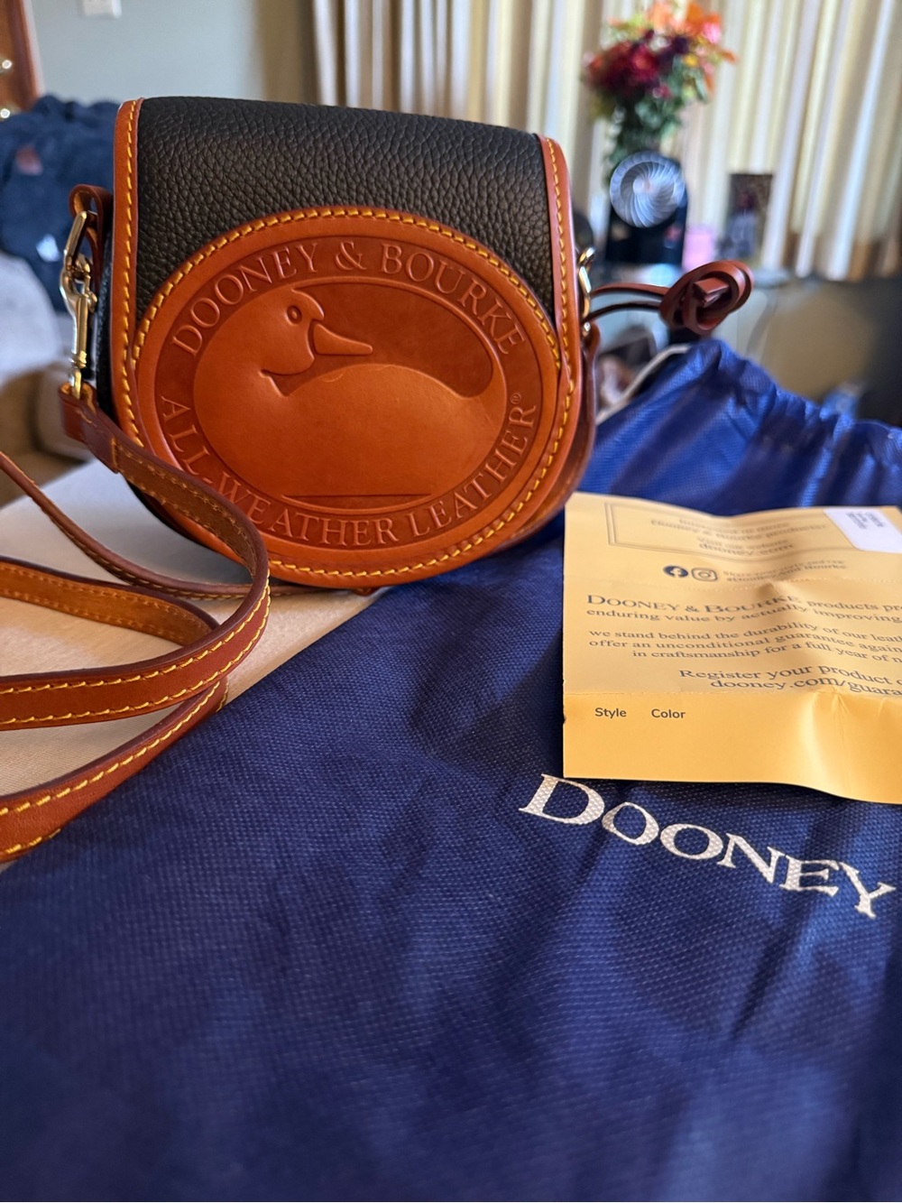 Dooney & Bourke Black and Brown Leather Saddle Crossbody